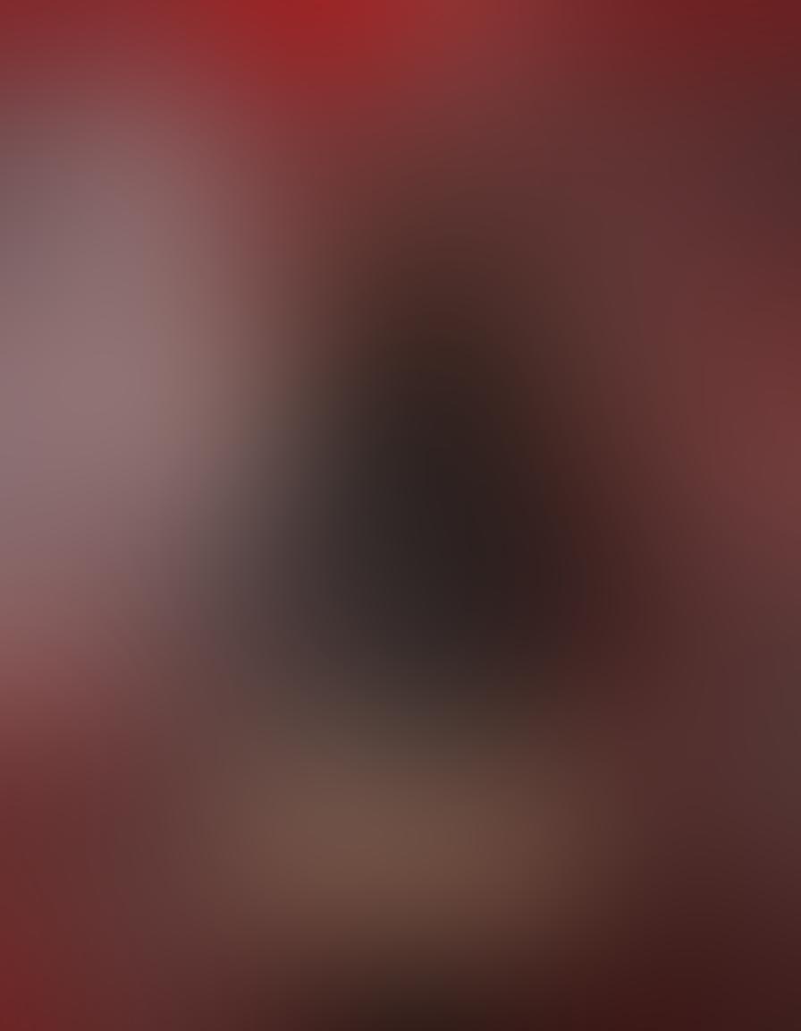 A dynamic collage featuring iconic scenes from adult films, intertwined with symbols of kink such as leather, whips, and masks. The background shows film reels and a cinematic lens, creating a vibrant atmosphere. Include soft, sultry lighting to evoke an intimate feel, with playful splashes of red and black for a bold contrast. The overall composition should be alluring and artistic, representing the fusion of kink culture and cinema. vibrant colors. 3D. cinematic style.